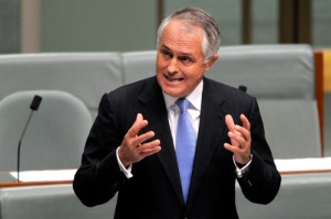 Malcolm Turnbull trying hard not to get his fingers on Tony Abbott's windpipe