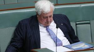 Clive Palmer hard at work on one of his sitting days